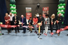 Gathering of elected officials, project stakeholders and students at ribbon-cutting for Highlandtown Elementary/Middle School