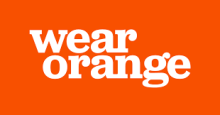 The image is a solid orange background with the words "wear orange" written in bold white letters.