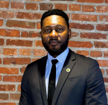 Professional headshot of Femi Ogundolie, Controller, for the Maryland Stadium Authority, in business attire at the Warehouse at Camden Yards